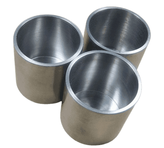 Three open cylindrical nickel crucibles showing interior finish and machined rims