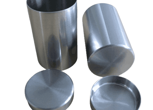 Nickel crucible vessels with matching lids shown beside the containers