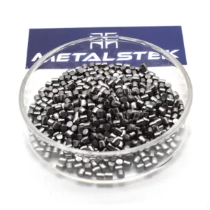 Tantalum evaporation material pieces in a glass dish, photographed by MetalsTek